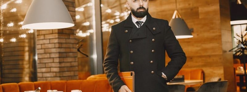 businessman-posing-restaurant_1157-45815